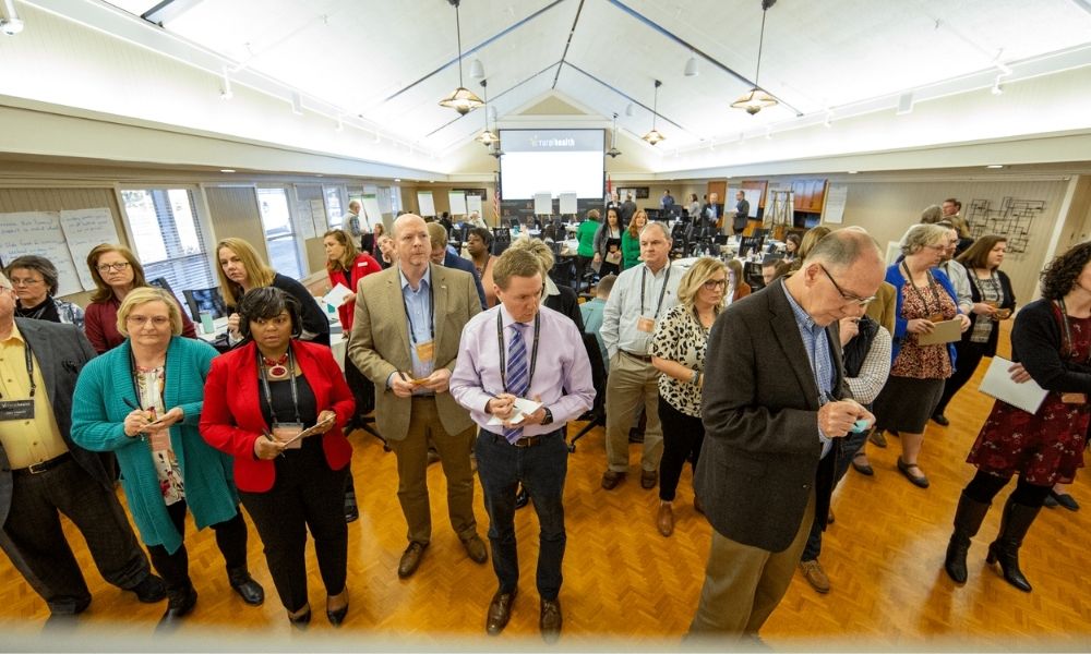 Adults gathered for a conference