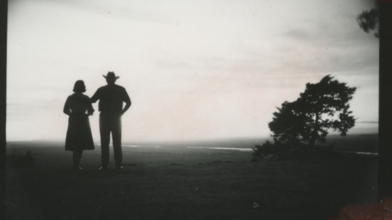 Silhouette of Winthrop and Jeannette Rockefeller standing while overlooking a valley at Winrock Farms.