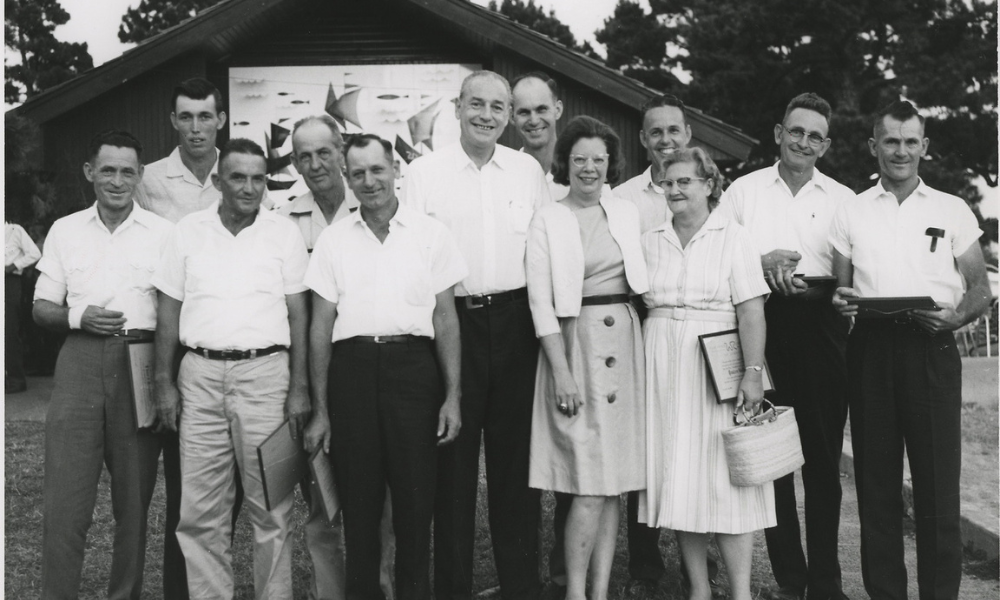 Winthrop and Jeannette Rockefeller standing with Winrock Farms employees